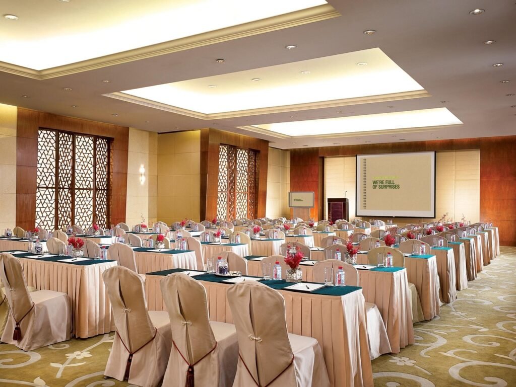 Conference and event accommodation planning with venue-based hotel blocks